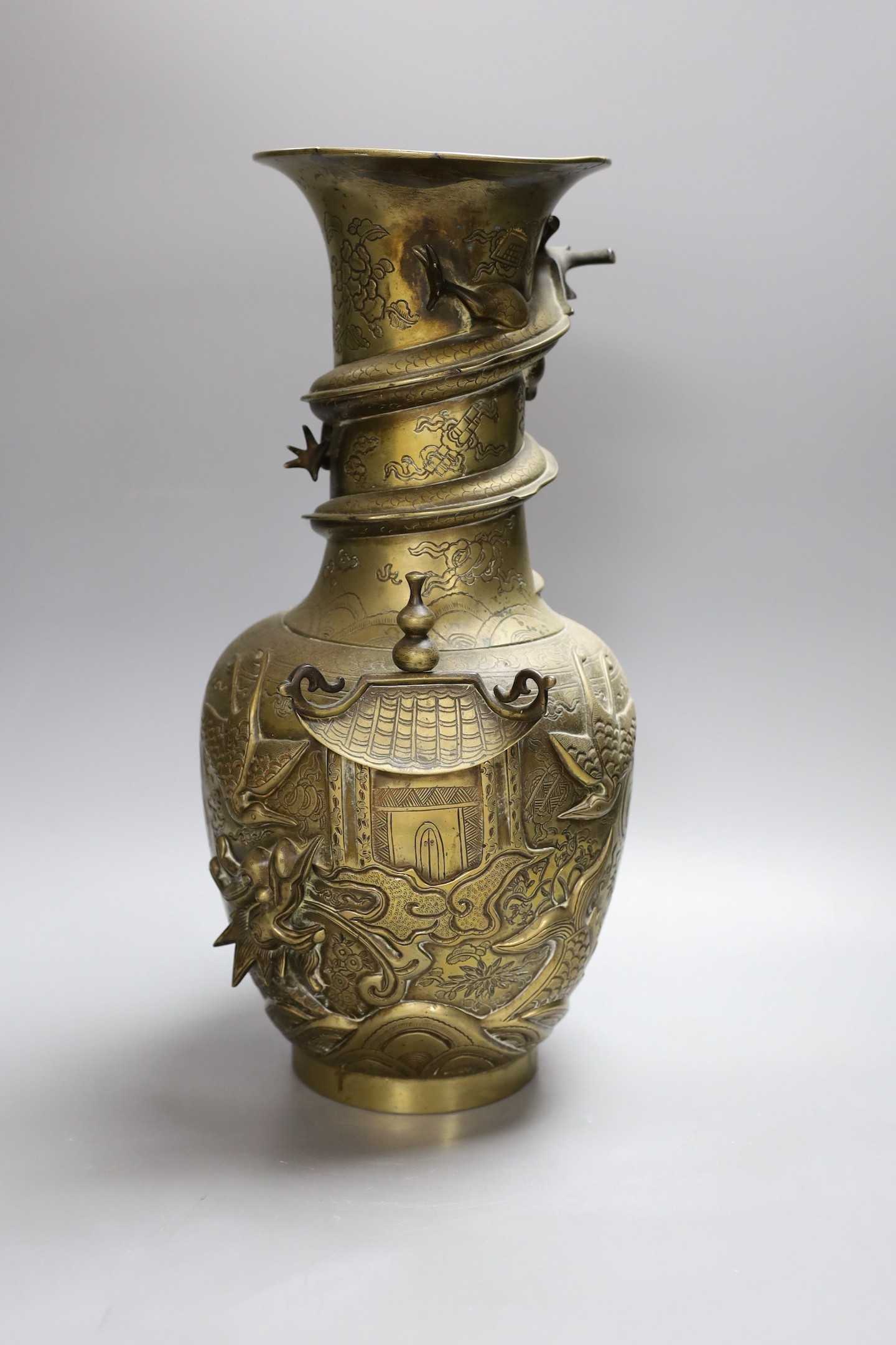 An early 20th century Chinese cast and engraved bronze vase, 42cm